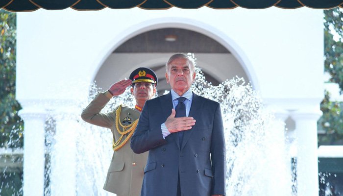 In this handout photograph released by the Press Information Department (PID) on April 12, 2022, Prime Minister Shehbaz Sharif receives guard of honor on his arrival in the Prime Minister House during a ceremony in Islamabad.