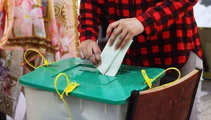 A representational image of a person casting his vote at a polling station in Karachi.