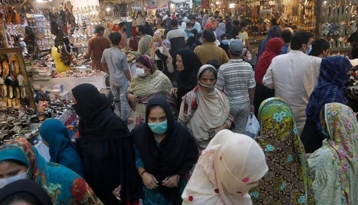 People can be seen shopping in a local market in Lahore on April 28, 2021. — APP/File
