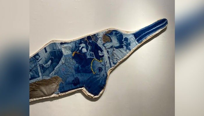 Image showing artwork in the shape of a dolphin displayed at the exhibition. — Uswah Zahid