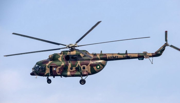 A Pakistan Army helicopter flies over the Pindi Cricket Stadium, in Rawalpindi on December 10, 2019. — AFP
