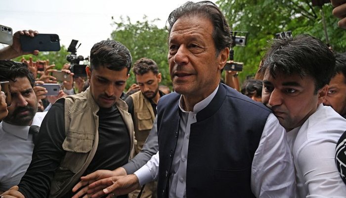Imran Khan, center, arrives to appear before an anti-terrorism court in Islamabad on August 25, 2022. — Aamir Qureshi/AFP
