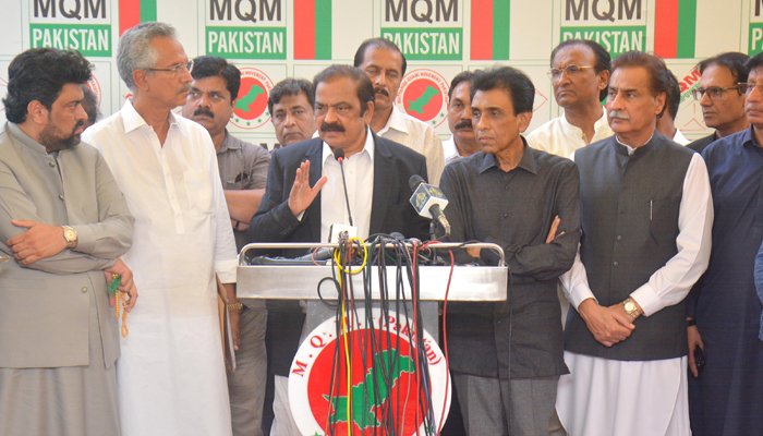 Interior Minister Rana Sanaullah (centre) addresses a press conference in Karachi alongside MQM-P leadership and federal minister Ayaz Sadiq (extreme right). — PID