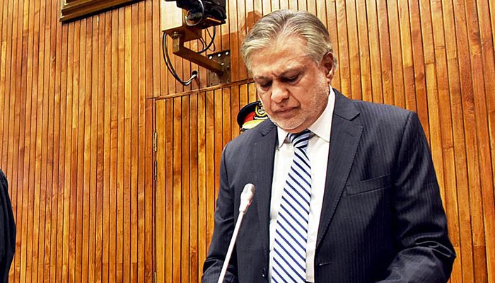 Chairman Senate Muhammad Sadiq Sanjrani (not pictured) administrates oath to the newly-elected Senator Muhammad Ishaq Dar during a Senate Session held at Parliament House in Islamabad on September 27, 2022. — PPI
