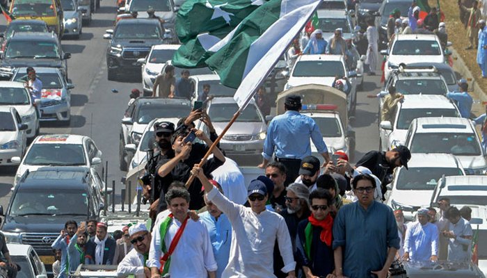 PTI Chairman Imran Khan along with supporters take part in a protest rally in Swabi on May 25, 2022. — AFP/File