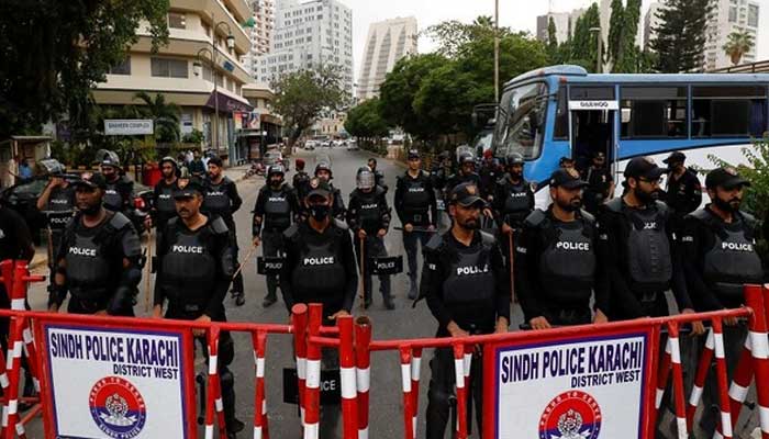 Sindh Police stand guard ahead of a protest in Karachi. — Reuters/File