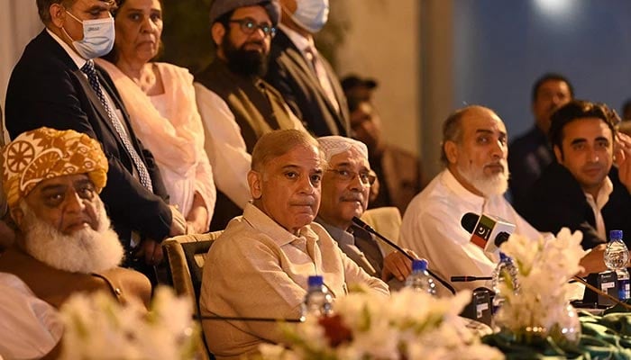 Prime Minister Shehbaz Sharif (centre), Asif Ali Zardari (right) and Fazlur Rehman (left) speak during a press conference in Islamabad, on March 28, 2022. — AFP
