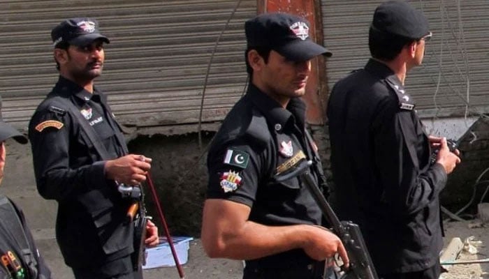 KP Police personnel patrol an area in this undated photo. —AFP/File