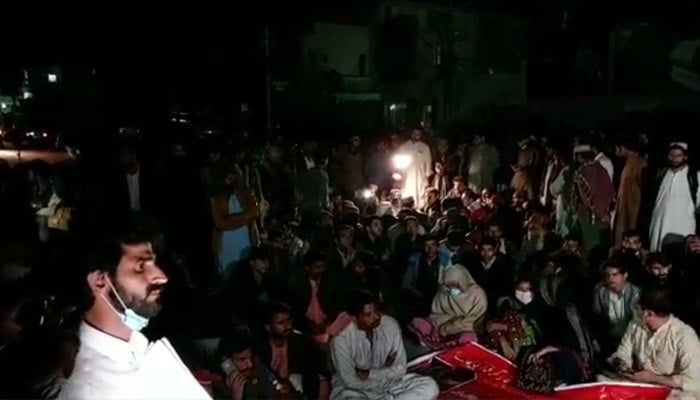 Tribal members stage a sit-in outside the Chief Minister house in Quetta, against the murder of a woman and her two children in Barkhan on February 21, 2023. — Twitter/@leokhanasim