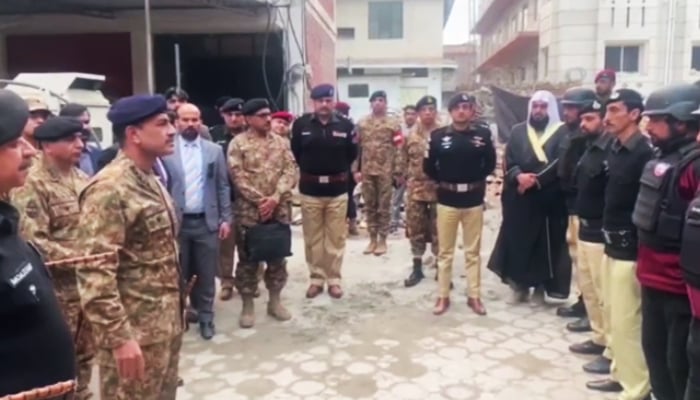 COAS General Asim Munir (left) meets police officers of the Khyber Pakhtunkhwa Police in Peshawar, on February 3, 2023. — ISPR