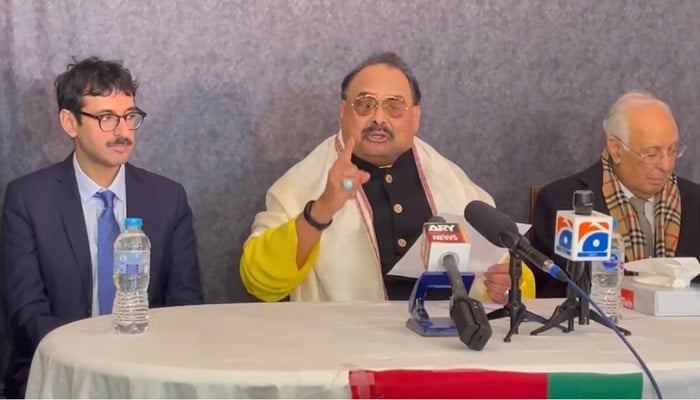 Altaf Hussain (centre) addresses a press conference after the judgment in the London properties case with his lawyer. — Photo by author