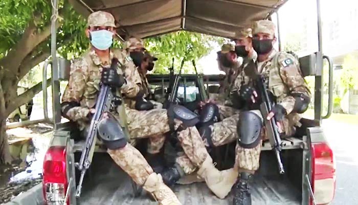 Pakistan Army troops can be seen in a military vehicle during reconnaissance at most sensitive constituencies ahead of the Punjab by-polls, on July 16, 2022, in this still taken from a video. — ISPR