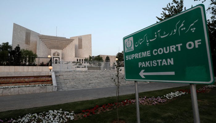 A sign board pointing towards the Supreme Court building in Islamabad. — Reuters/File