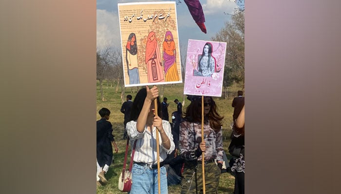 Women holding banners in a rally held in Islamabad on March 7 ahead of the Aurat March. Twitter/@AuratAzadiMarch