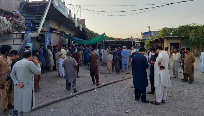 People gather at the site of the incident in Peshawar on May 18, 2023. — GeoNews