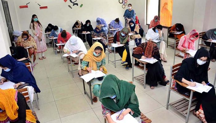 Students attempt exams at a centre in Peshawar. — APP/File