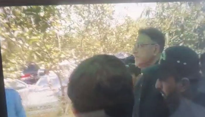 PTI Secretary General Asad Umar being taken from the IHC premises by Islamabad police. — AFP/File