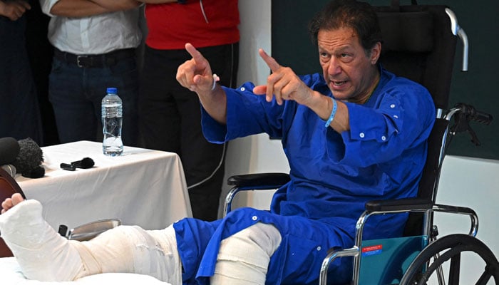 In this picture taken on on November 4, 2022, Imran Khan addresses the media representatives at a hospital in Lahore, a day after an assassination attempt on him. — AFP