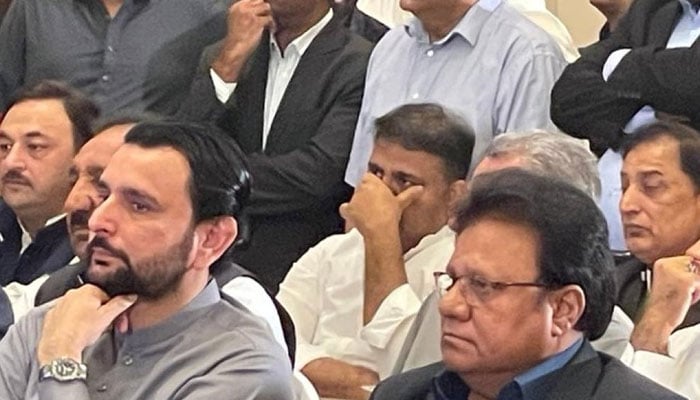 Fawad Chaudhry is seen sitting at a launching ceremony of the Istihkam-e-Pakistan Party. — Twitter/@iihtish